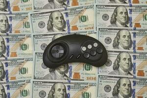 Game console controller and pile of money photo