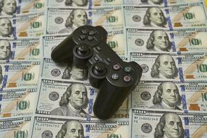 Game console controller and pile of money photo