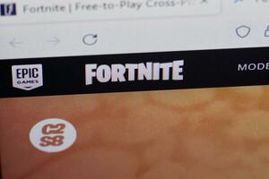 Fortnite official website on computer monitor photo