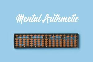 Abacus for mental math. Abacus on colored background photo