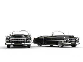 Two awesome black vintage cars - side by side photo