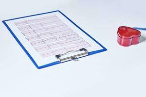 Medical cardiogram printed on paper on the table photo