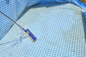 Cleaning home inflatable swimming pool photo