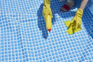 Cleaning home inflatable swimming pool photo