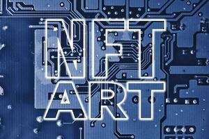 NFT art text on blue printed circuit board. Electronic board and NFT technology. Rolling out new NFT technology photo