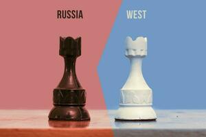 Two chess figures - showing confrontation between Russia and the West photo