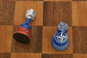 Two chess figures - showing confrontation between Russia and NATO photo