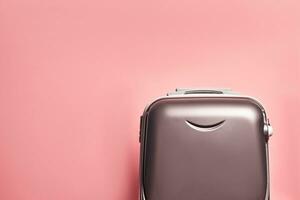 Travel bag on pink photo