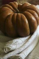 Cozy autumn background with pumpkin photo