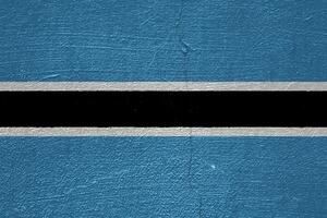 bandera de república de Botswana en un texturizado antecedentes. concepto collage. foto