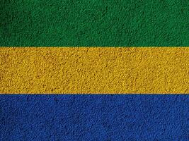 Flag of Republic of Gabon on a textured background. Concept collage. photo