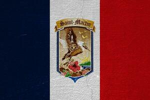 Flag and coat of arms of Collectivity of Saint Martin on a textured background. Concept collage. photo