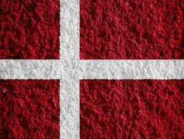 Flag of Denmark on a textured background. Concept collage. photo