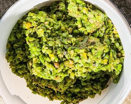 The process of making homemade grape wine. The operation of a hydraulic press to obtain grape juice for fermentation. Close-up of freshly squeezed grape pomace. photo