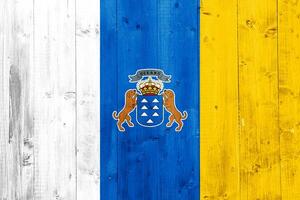 Flag and coat of arms of Canary Islands on a textured background. Concept collage. photo
