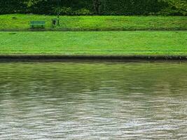 View of embankment with River Wisla in Krakow, Poland. Overcast weather. Cloudy. photo