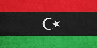 Flag of State of Libya on a textured background. Concept collage. photo