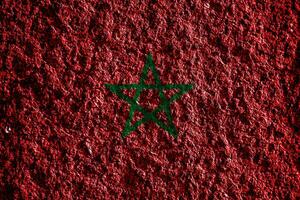 bandera de Reino de Marruecos en un texturizado antecedentes. concepto collage. foto