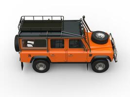 Sun orange heavy off road vehicle - top down side view photo