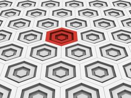 One red hexagon shape stands out in the white background photo