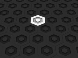 Dark hexagon tile background, one white hexagon stands out photo