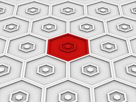 Red small hexagon stands out of white background filled with hexagons photo