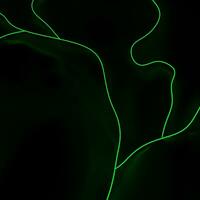 Bright green abstract shape lights on black landscape photo