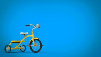 Vintage yellow pretty tricycle - blue background photo