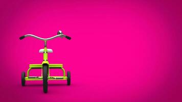 Sweet green pretty tricycle - front view - pink background photo