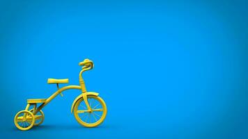 Beautiful bright yellow tricycle on blue background photo