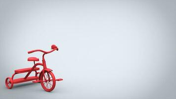 Beautiful red toy tricycle on bright background photo