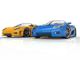 Blue and yellow sportscars on reflective background photo