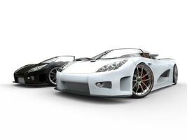 Black and white sports cars - on white background photo