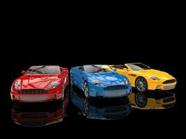 Modern convertible sports cars - on reflective background photo