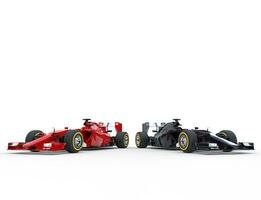 Red and black formula one cars side by side photo