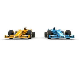Yellow and blue formula one cars - side by side - studio shot photo