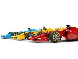 Colorful formula one cars - isolated on white background. photo