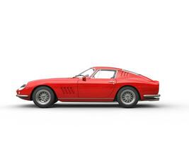 Red vintage sports car - side view - isolated on white background photo