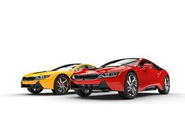 Modern sports cars - red and yellow - isolated on white background. photo