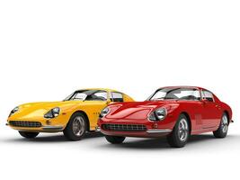 Yellow and red classic vintage sports cars - isolated on white background photo