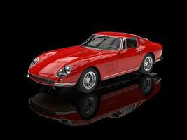 Red vintage sports car - isolated on black reflective background photo