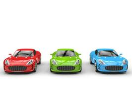 Beautiful sports cars - red, green and blue - front view photo