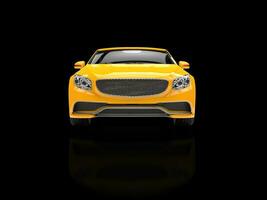 Yellow modern business car - on black reflective background - front view photo