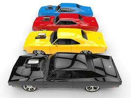 Colorful vintage muscle cars in a row - side view photo