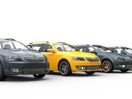 Row of family cars - yellow stands out photo