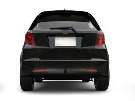 Black metallic modern compact car - back view photo