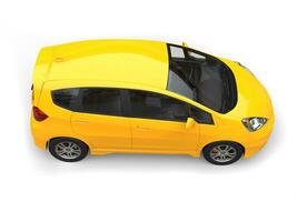 Yellow modern compact car - top side view photo