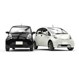 Black and white small ecomonic electric cars side by side photo