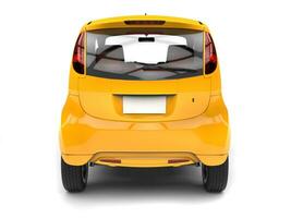 Gold yellow  compact car - back view photo