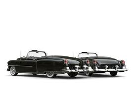 Two awesome black vintage cars - taillight view photo